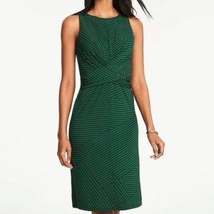 EUC flattering fit green and navy striped Ann Taylor dress with twist in front.